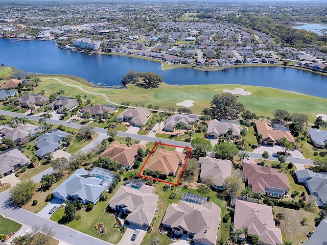 birds eye view of property featuring a residential view, golf course view, and a water view