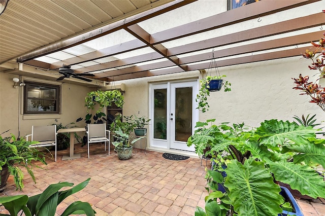 view of patio / terrace with a ceiling fan and a pergola