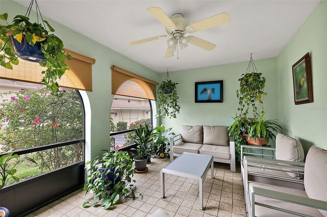 sunroom with a ceiling fan