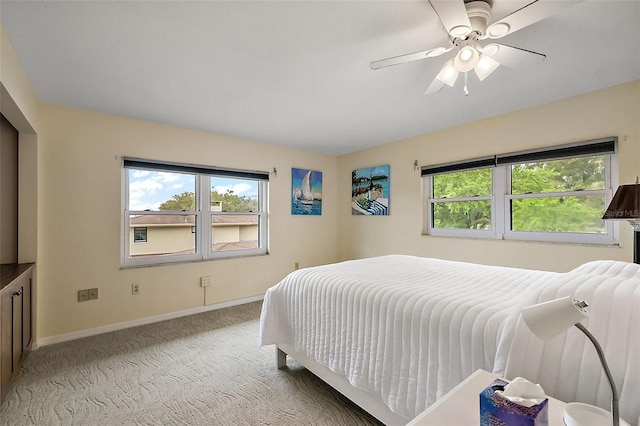 bedroom with carpet flooring, ceiling fan, and baseboards