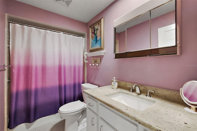 bathroom featuring vanity, a shower with shower curtain, toilet, and visible vents