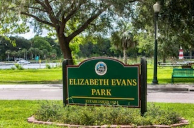 community / neighborhood sign with a lawn