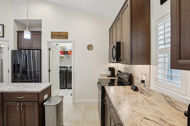 kitchen with light stone counters, dark brown cabinetry, and black appliances