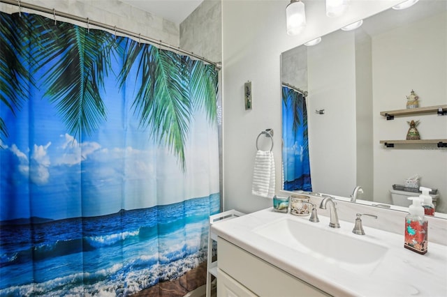 bathroom featuring vanity and a shower with shower curtain