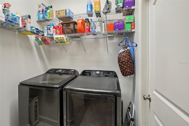 laundry room featuring independent washer and dryer and laundry area