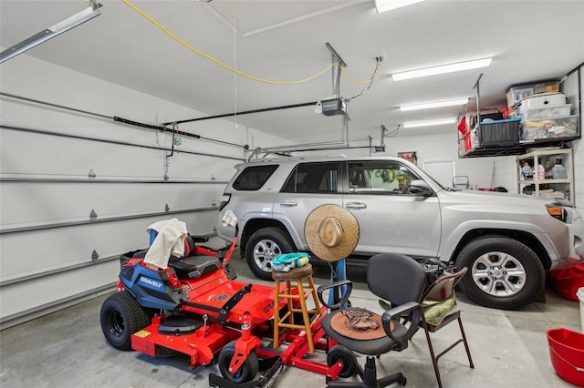 garage featuring a garage door opener