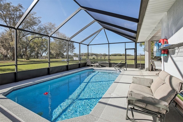 outdoor pool with glass enclosure and a patio