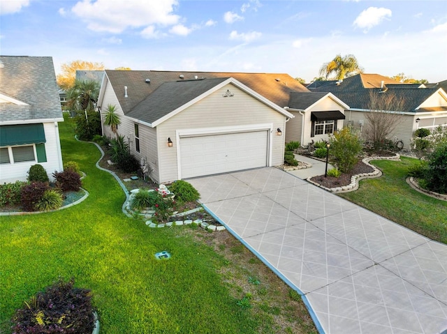 ranch-style house featuring concrete driveway, an attached garage, and a front yard