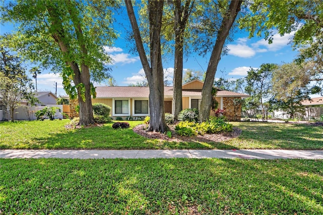 ranch-style house with a front yard