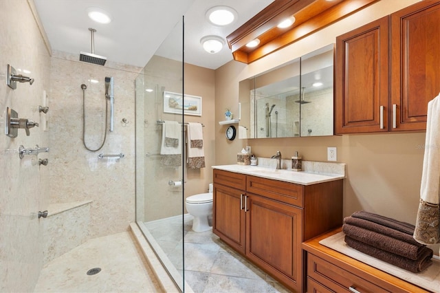 full bath with vanity, a shower stall, toilet, and visible vents