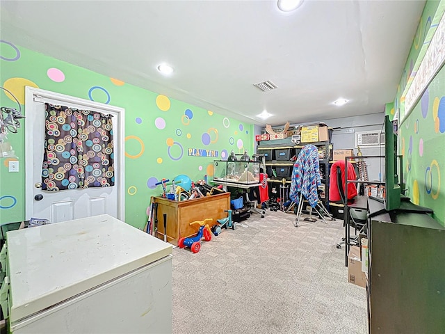 rec room with carpet, recessed lighting, and visible vents