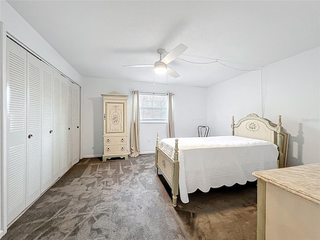 bedroom featuring a closet, baseboards, carpet, and a ceiling fan