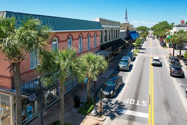 view of road featuring curbs and sidewalks