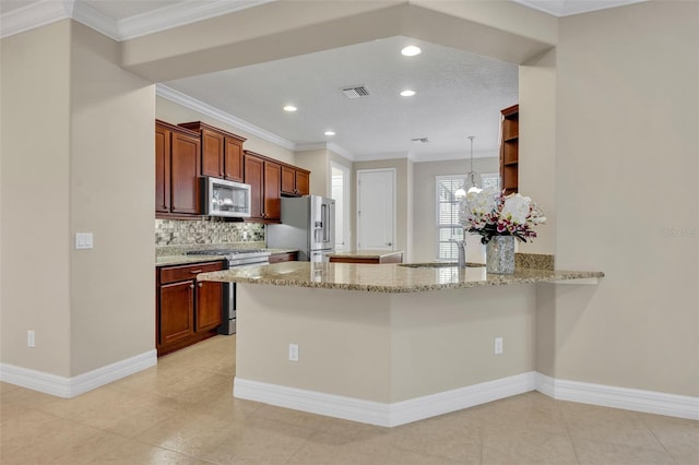 kitchen featuring visible vents, a peninsula, ornamental molding, decorative backsplash, and stainless steel appliances