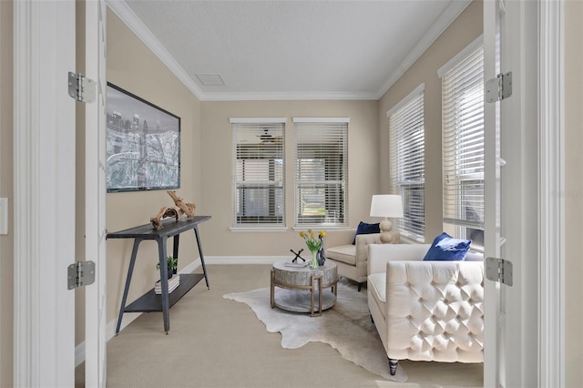 living area with baseboards, carpet, and ornamental molding