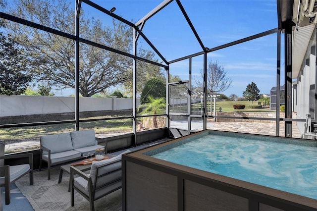 view of pool featuring glass enclosure, a patio, and outdoor lounge area