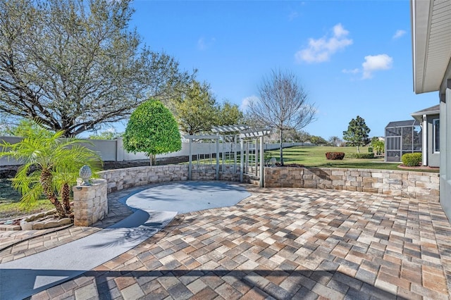 view of patio featuring fence, a lanai, and a pergola