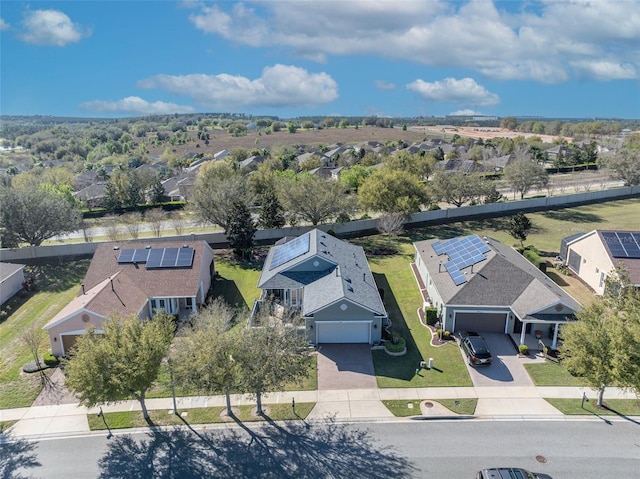 birds eye view of property with a residential view