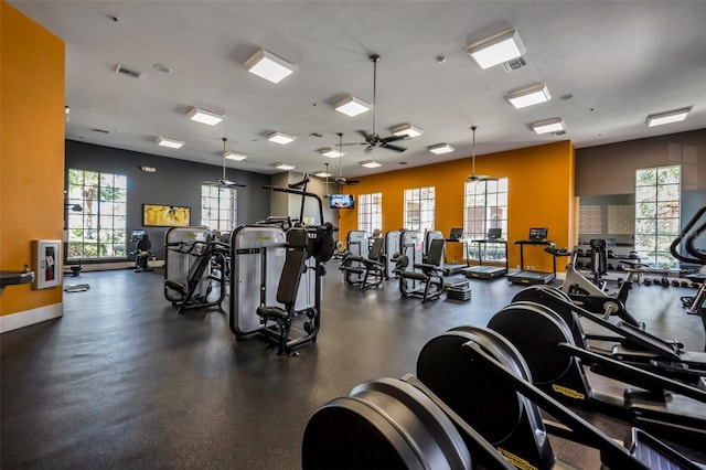 workout area featuring visible vents, baseboards, and ceiling fan