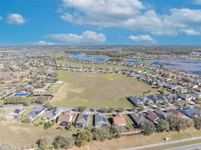 birds eye view of property with a residential view and a water view