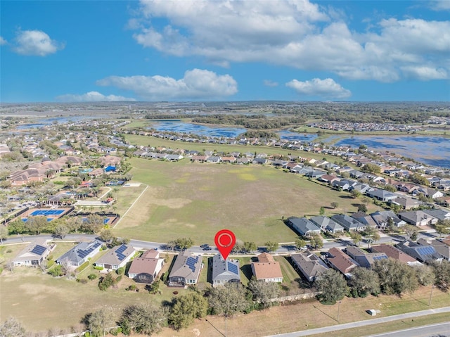 drone / aerial view with a water view and a residential view