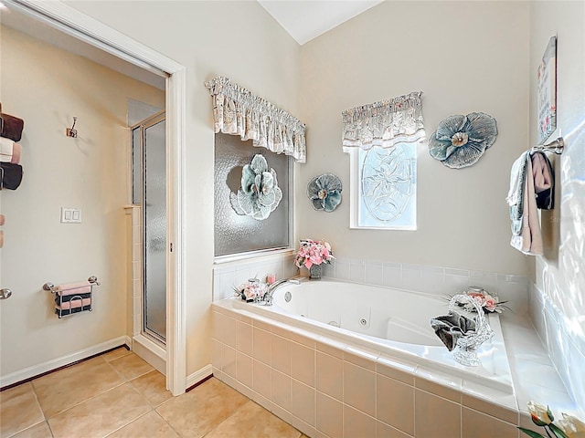 bathroom with tile patterned flooring, a stall shower, and a whirlpool tub