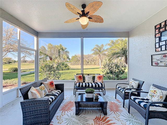 sunroom / solarium with a ceiling fan