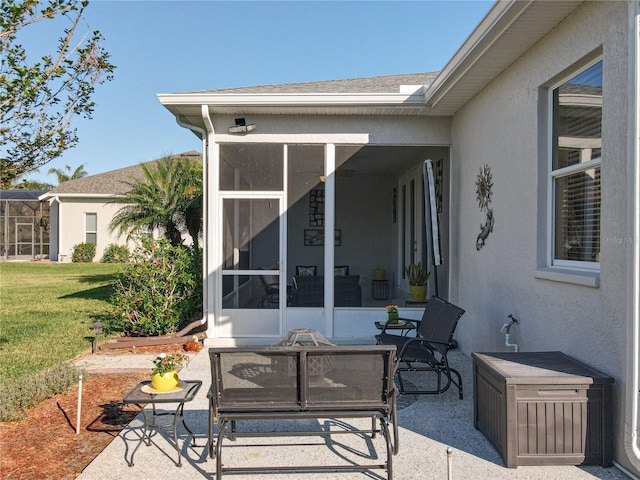 view of patio featuring a sunroom