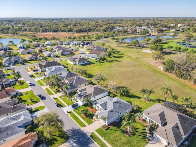 bird's eye view featuring a residential view and a water view