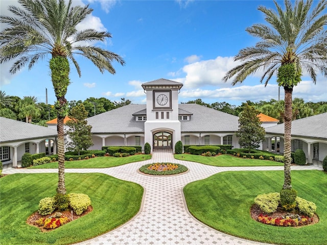 view of building exterior with curved driveway