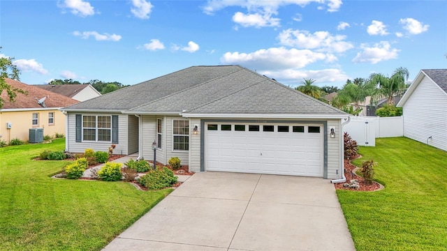 ranch-style house with driveway, central AC, fence, a front yard, and an attached garage