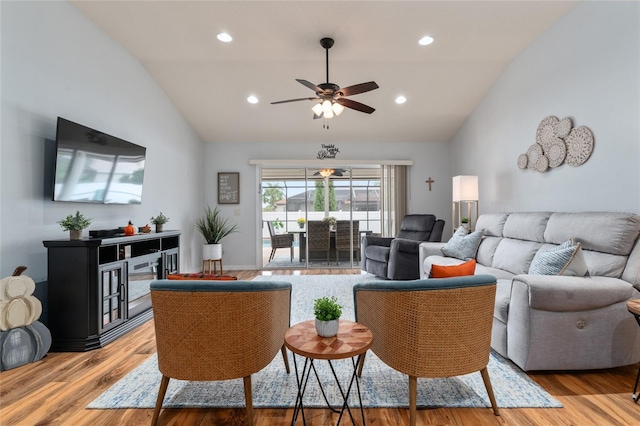 living area featuring recessed lighting, lofted ceiling, wood finished floors, and a ceiling fan