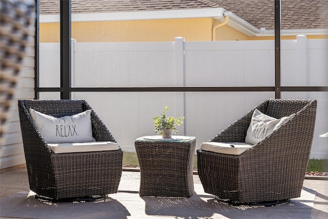 view of patio / terrace featuring fence