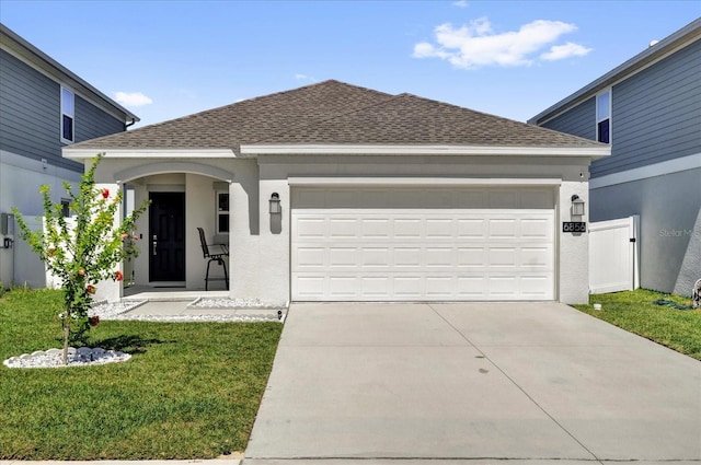 single story home featuring a shingled roof, concrete driveway, a garage, and stucco siding