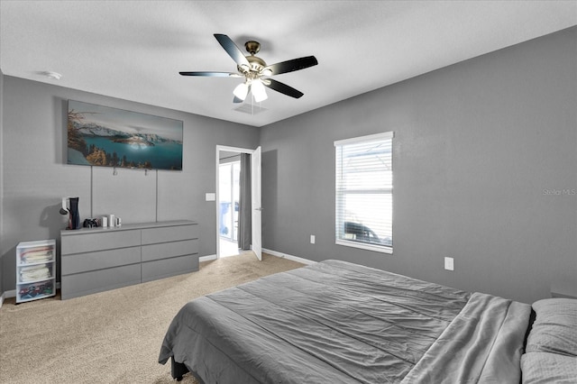 bedroom with carpet flooring, ceiling fan, baseboards, and visible vents