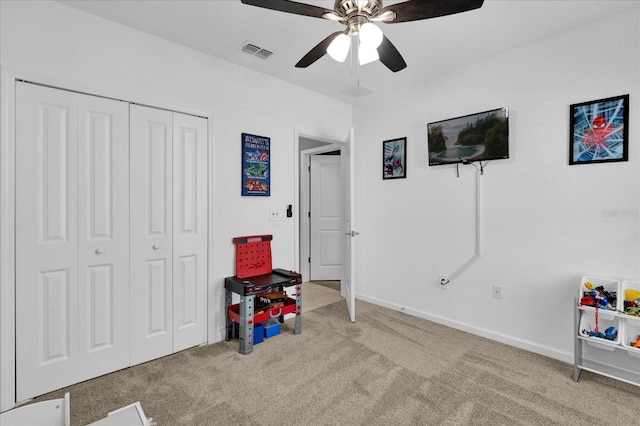 recreation room with visible vents, baseboards, ceiling fan, and carpet floors