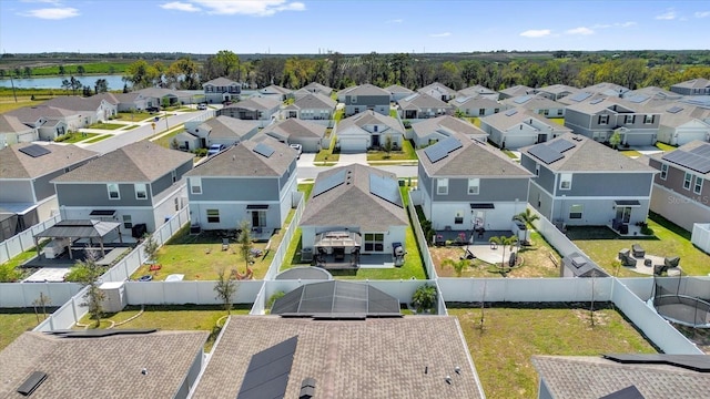 aerial view featuring a residential view and a water view