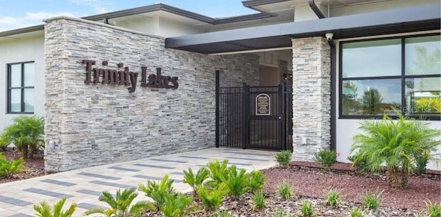 view of exterior entry featuring stucco siding