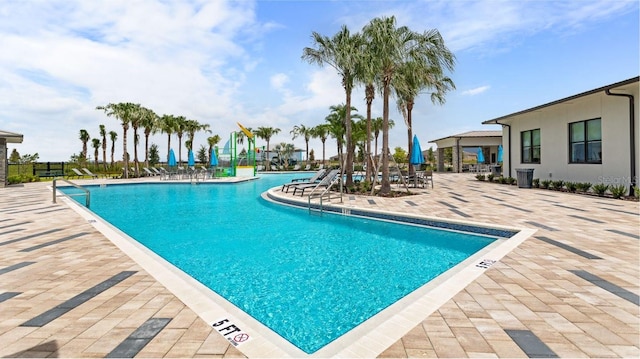 pool featuring a patio and fence