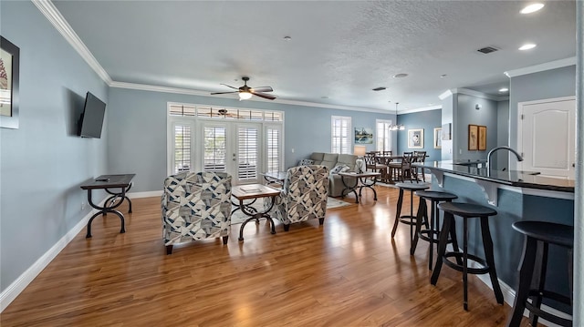 164 Nautica Mile Dr, Clermont, FL 34711 - dining room featuring visible vents, baseboards, ceiling fan, and wood finished floors