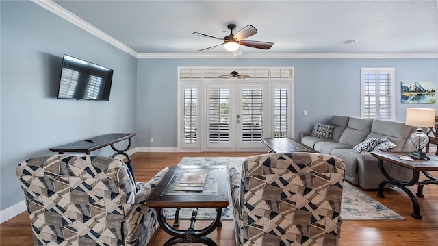 164 Nautica Mile Dr, Clermont, FL 34711 - living room with baseboards, wood finished floors, a ceiling fan, and ornamental molding