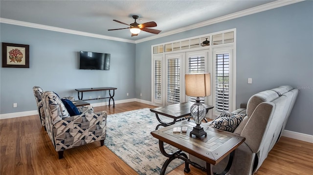 164 Nautica Mile Dr, Clermont, FL 34711 - living room with a ceiling fan, crown molding, baseboards, and wood finished floors