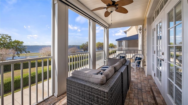 164 Nautica Mile Dr, Clermont, FL 34711 - sunroom with a healthy amount of sunlight, french doors, ceiling fan, and a water view