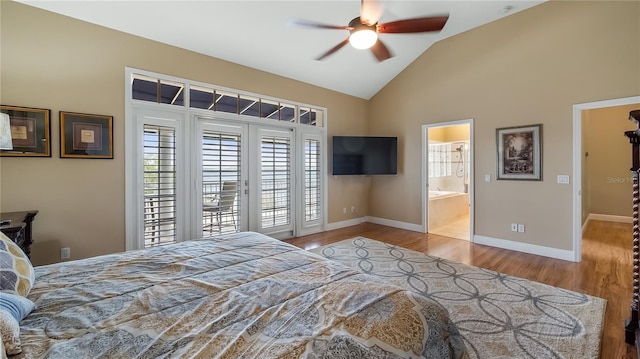 164 Nautica Mile Dr, Clermont, FL 34711 - bedroom featuring access to exterior, baseboards, vaulted ceiling, wood finished floors, and ensuite bath