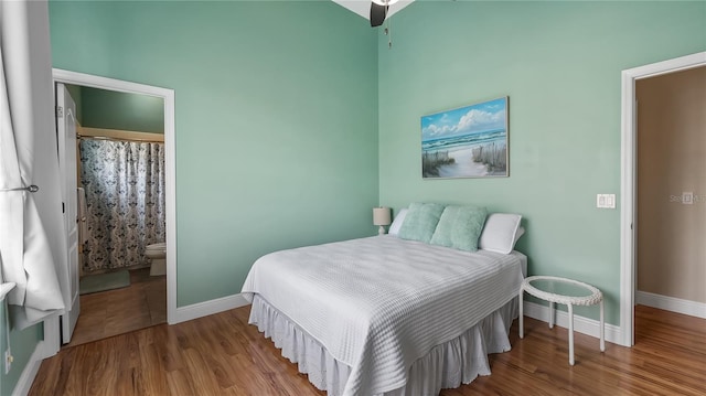 164 Nautica Mile Dr, Clermont, FL 34711 - bedroom with baseboards, ensuite bath, and wood finished floors
