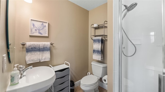 164 Nautica Mile Dr, Clermont, FL 34711 - bathroom with toilet, baseboards, a stall shower, and a sink