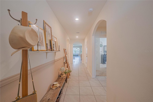 3719 Holly Grove Ln, Mount Dora, FL 32757 - corridor featuring arched walkways, light tile patterned flooring, and recessed lighting