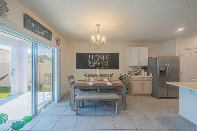 3719 Holly Grove Ln, Mount Dora, FL 32757 - dining room featuring a chandelier, light tile patterned floors, and baseboards