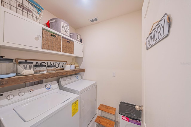 3719 Holly Grove Ln, Mount Dora, FL 32757 - clothes washing area with independent washer and dryer and cabinet space