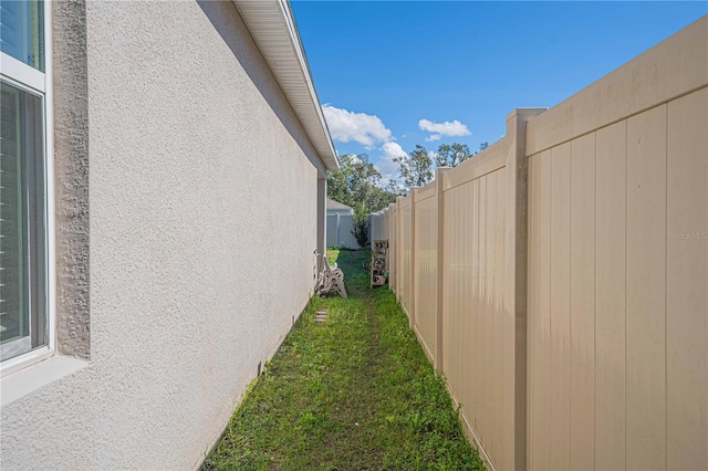 3719 Holly Grove Ln, Mount Dora, FL 32757 - view of home's exterior with fence and stucco siding